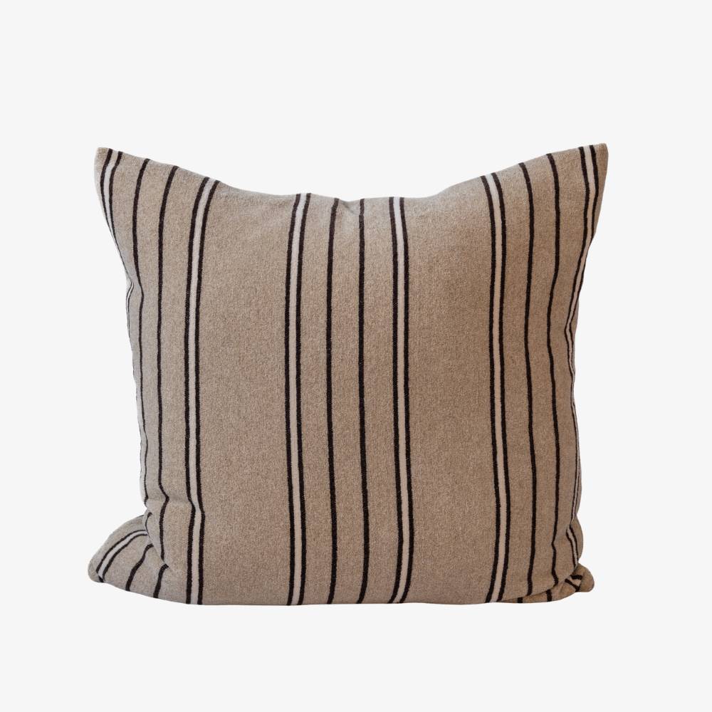 Beige pillow with black stripes on a white background