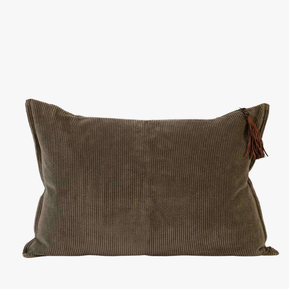 Dark green corduroy pillow with a tassel on a white background