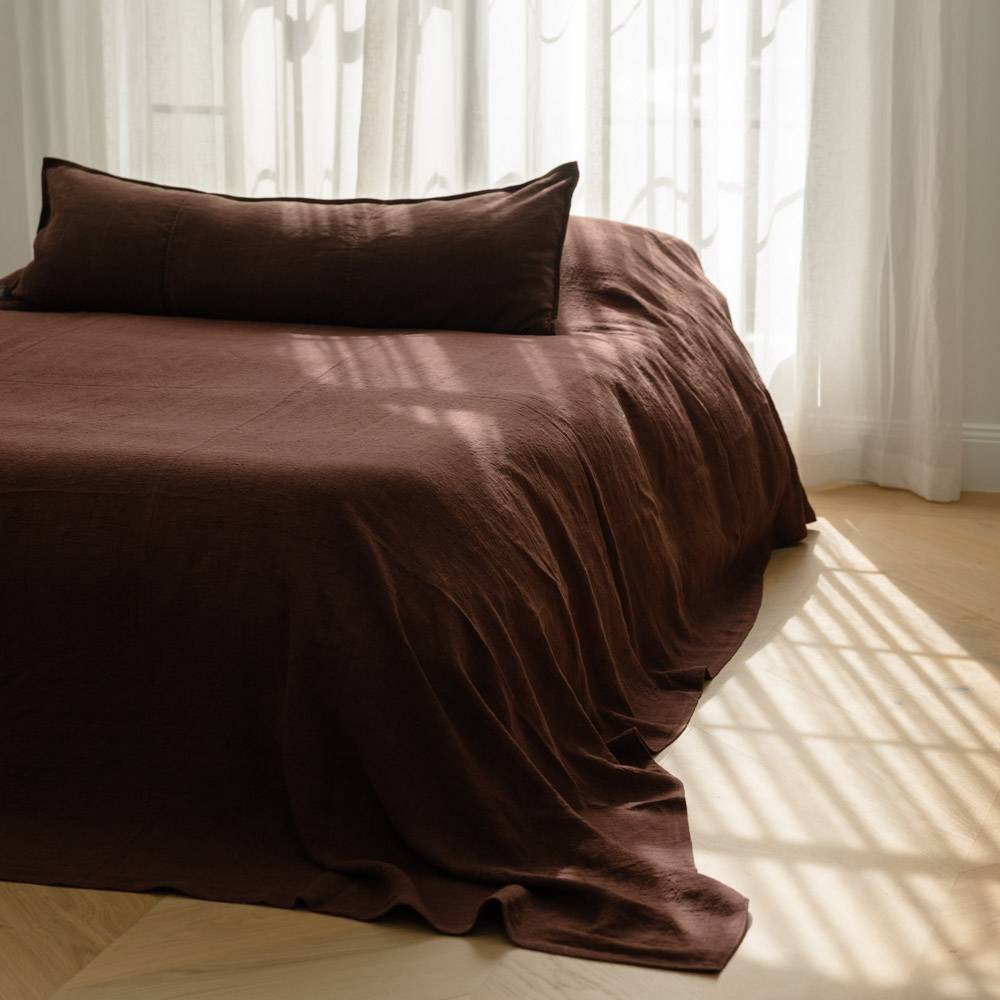 Summer styled bed - Chocolate Luca Bed Cover paired with a chocolate coloured long linen lumber