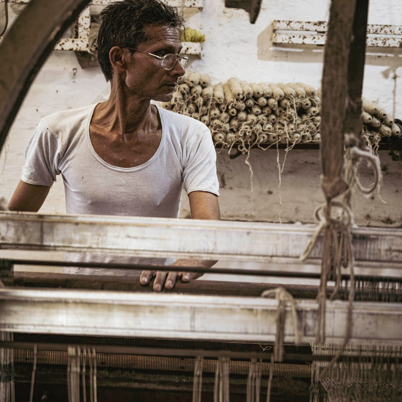 artisans in India using the ancient hand looming technique