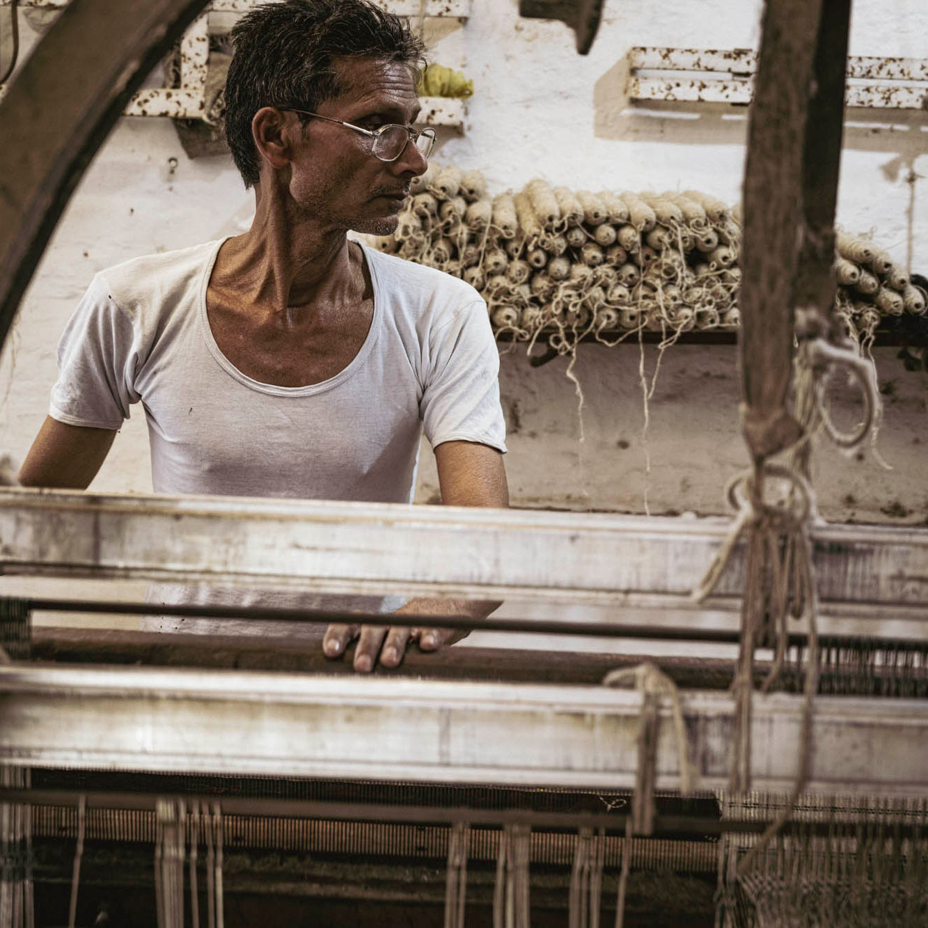 artisans in India using the ancient hand looming technique