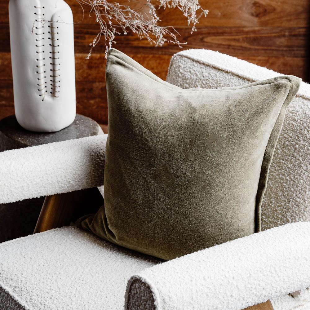 Evelyn Velvet Cushion in Olive on chair