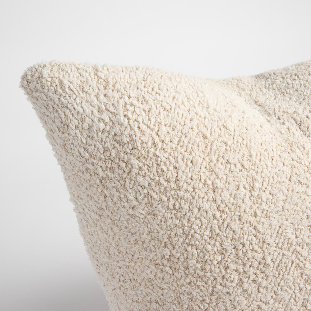 Close-up of the corner of a beige cushion