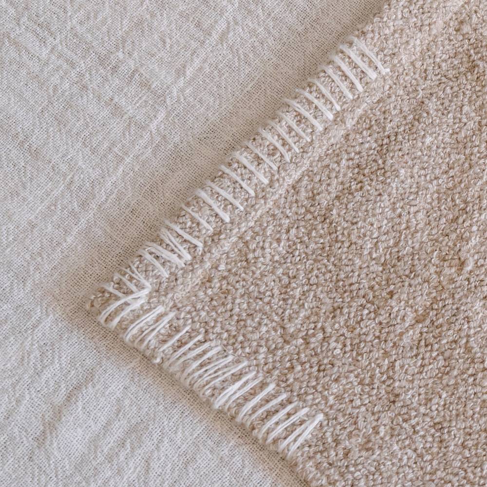 Close-up of beige fabric with textured pattern