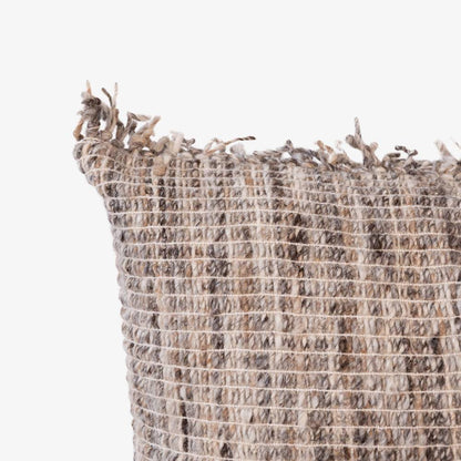 Textured woven linen with tassels on a white background
