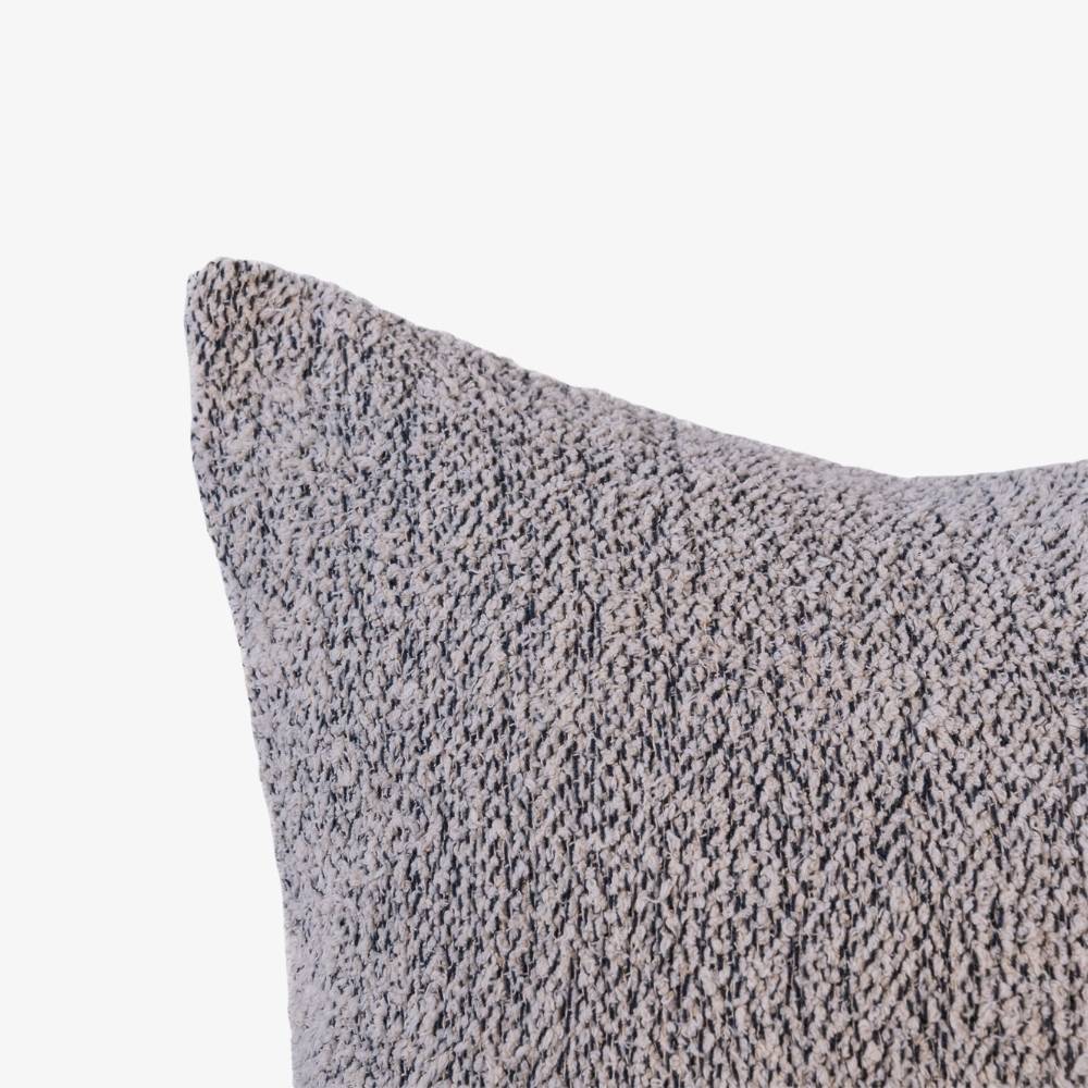 Textured gray pillow on a white background