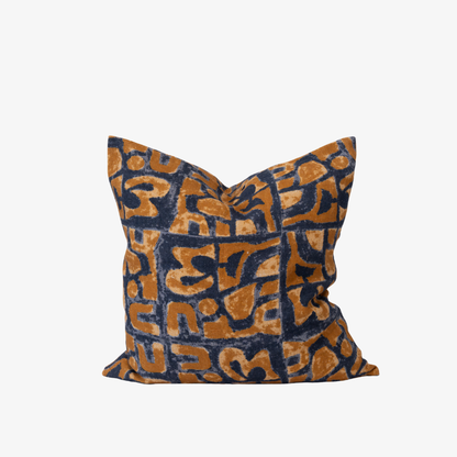 Decorative pillow with brown and blue pattern on a white background