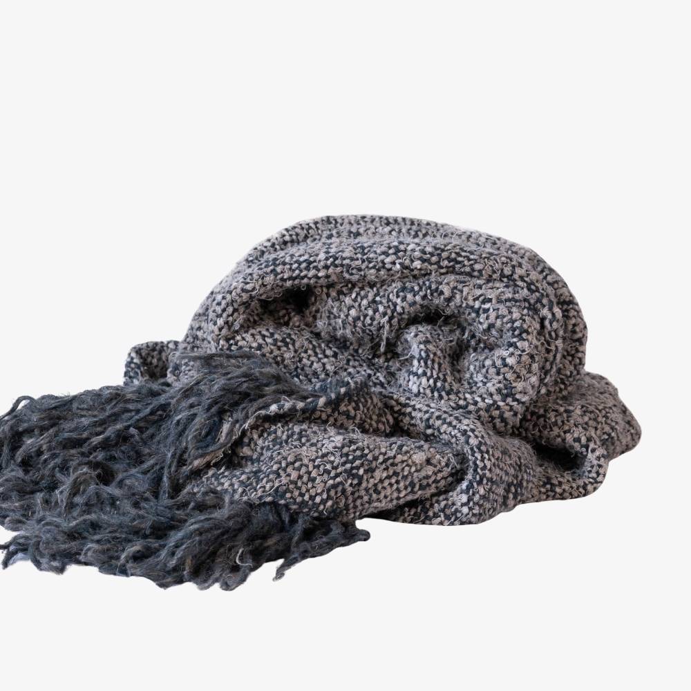Knitted scarf with fringe on a white background