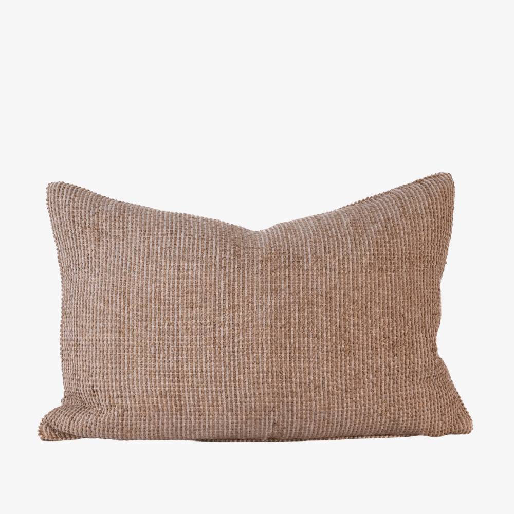 Textured brown pillow on a white background