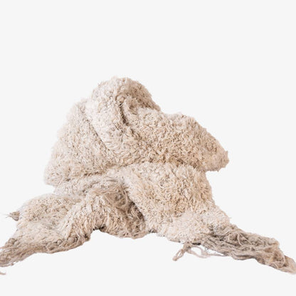 Textured beige fabric on a white background