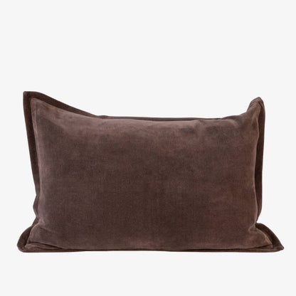 Brown velvet pillow on a white background