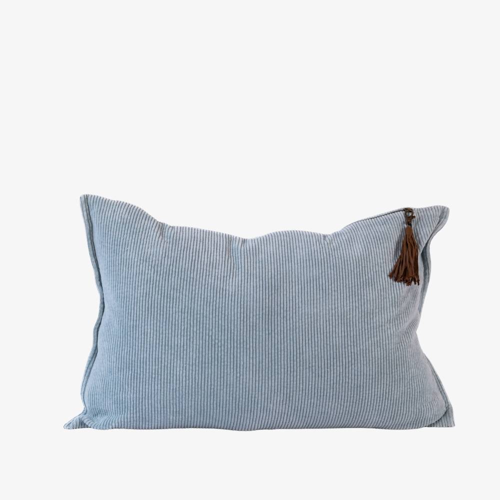 Light blue striped pillow with a brown tassel on a white background