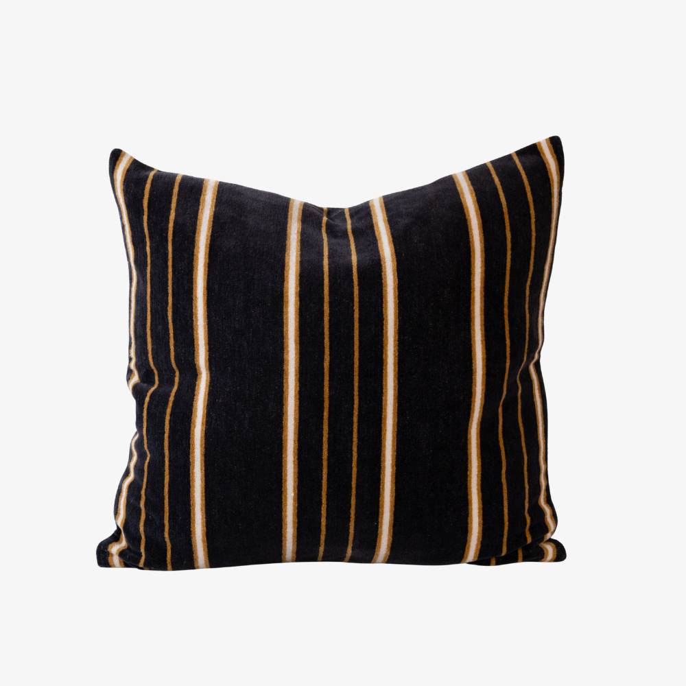 Striped pillow with black, white and beige pattern on a white background
