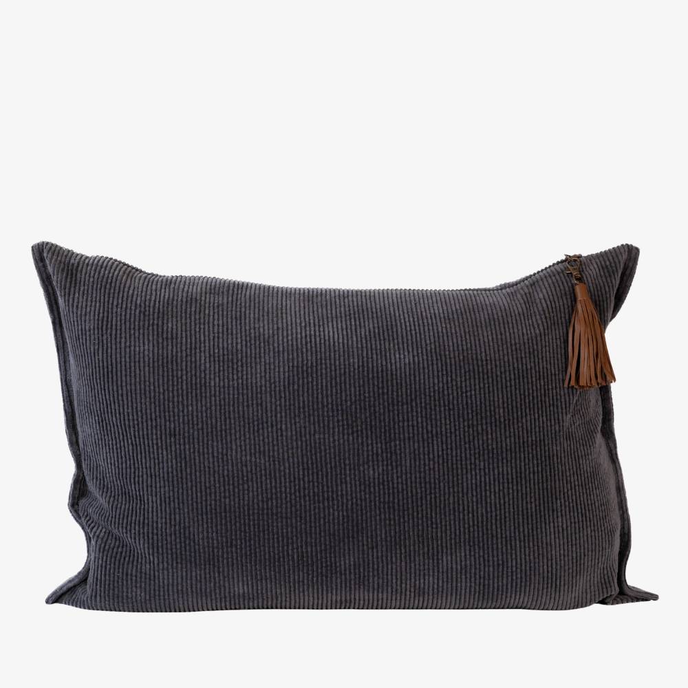 Dark blue cushion with a brown tassel on a white background