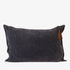 Dark blue cushion with a brown tassel on a white background