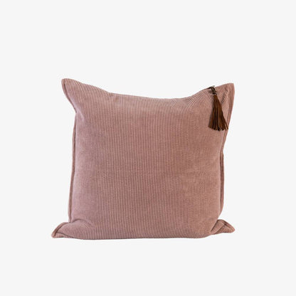Pink cushion with a tassel on a white background