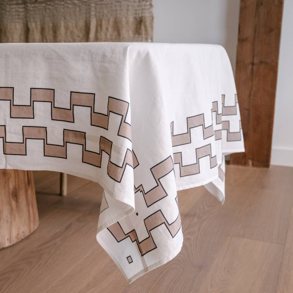 Tablecloth with geometric pattern on a wooden table