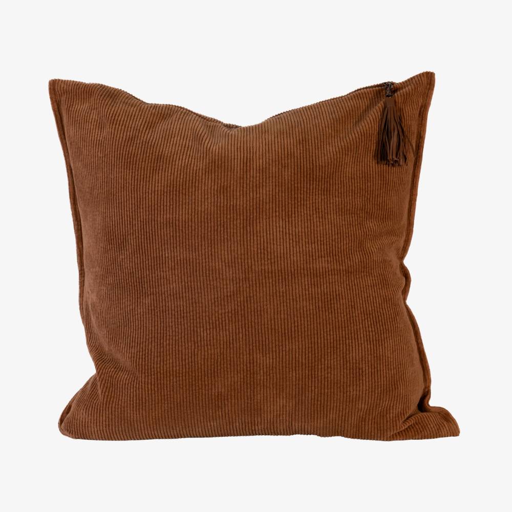 Brown corduroy pillow with a tassel on a white background