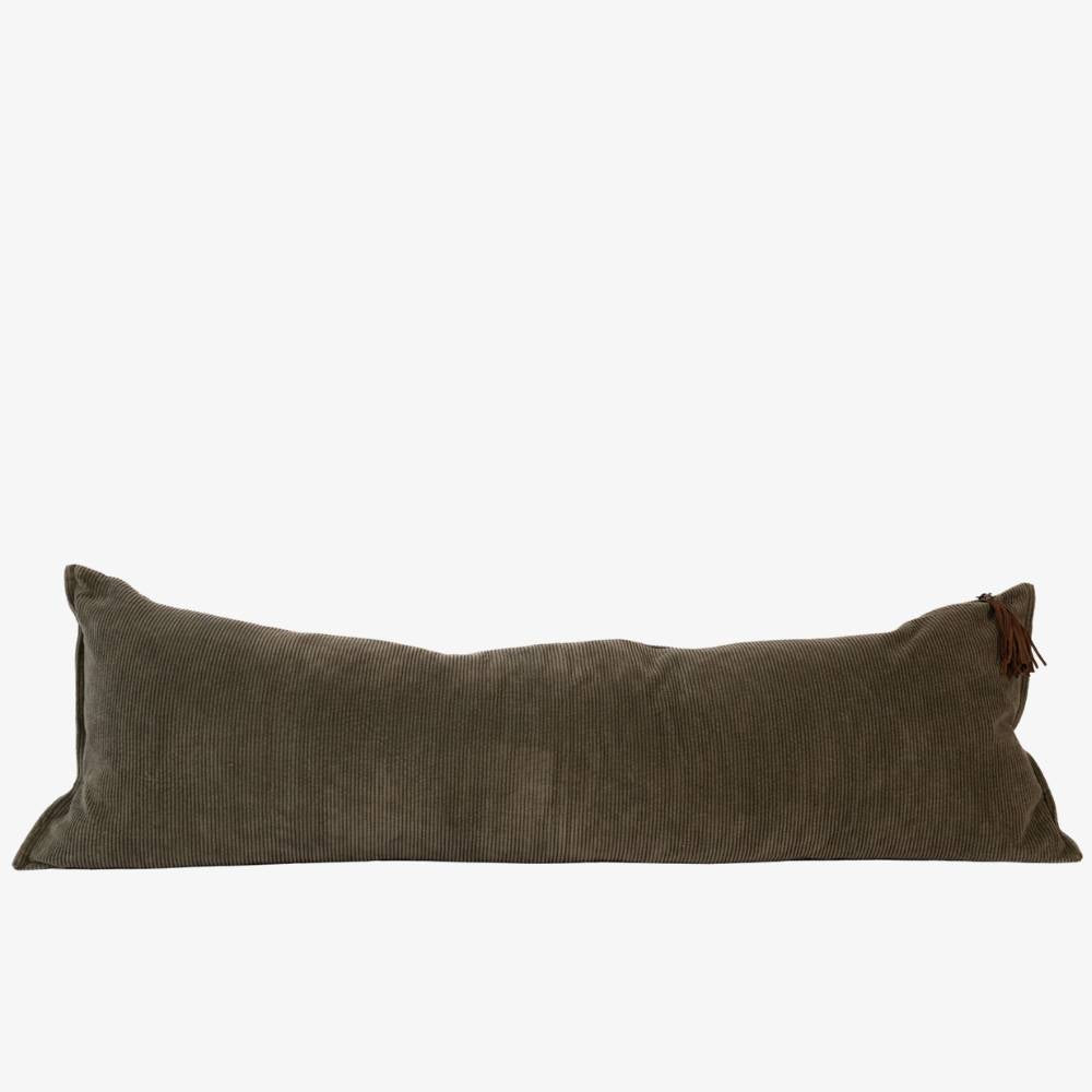 Long brown pillow with a tufted design on a white background