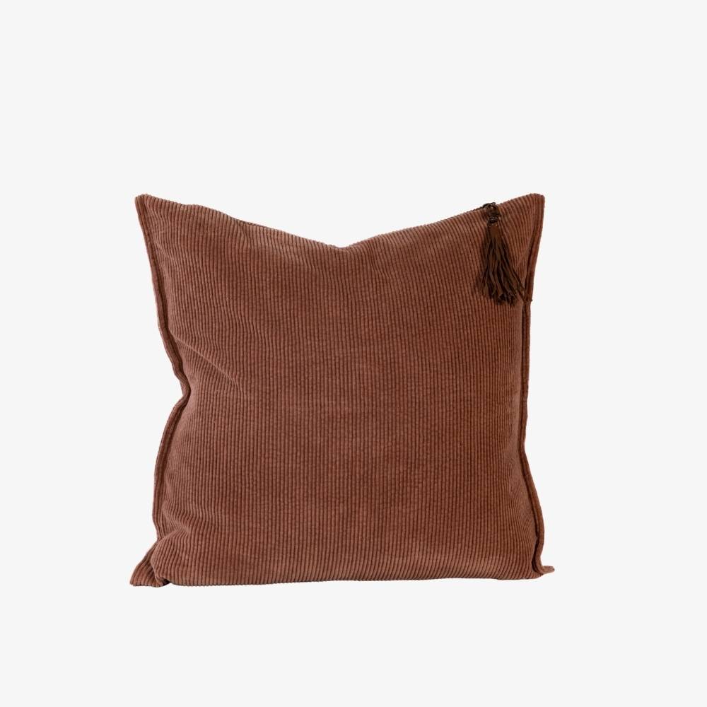 Brown pillow with tassel on a white background
