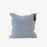 Blue striped pillow with a tassel on a white background