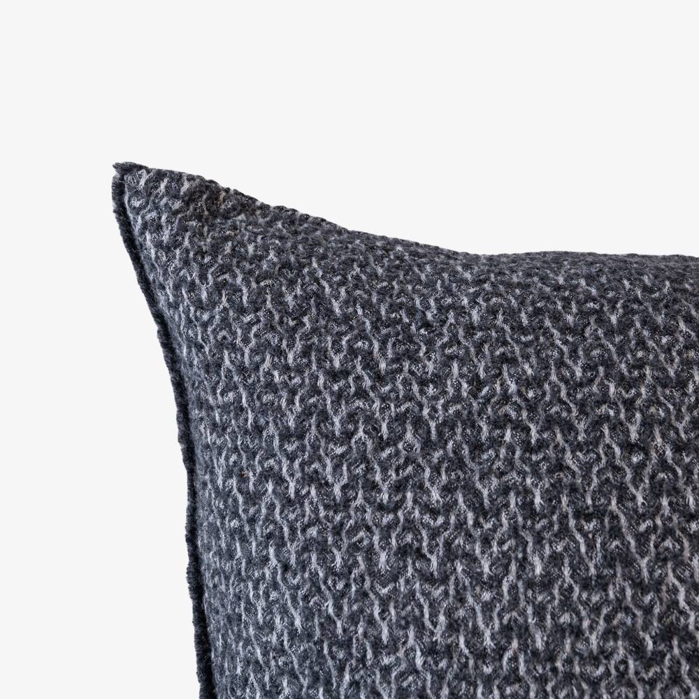 Textured gray pillow on a white background