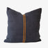 Dark blue pillow with an orange stripe on a white background