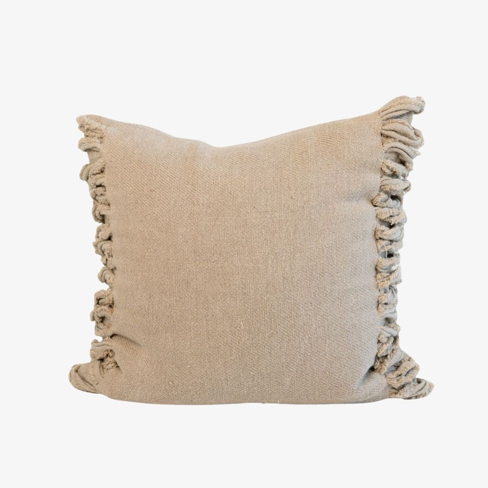 Beige pillow with ruffled edges