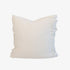 White pillow with fringe detail