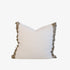 White pillow with beige ruffled edges 