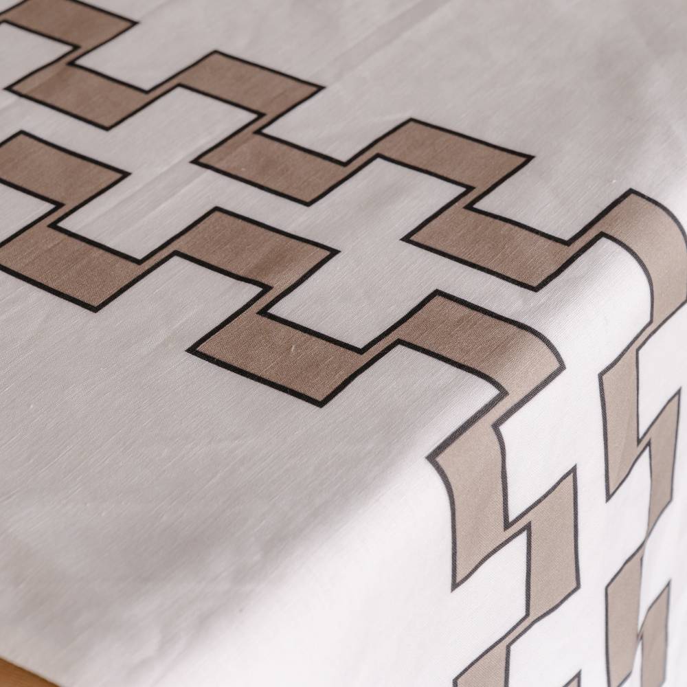 Close-up of a geometric pattern on a fabric surface