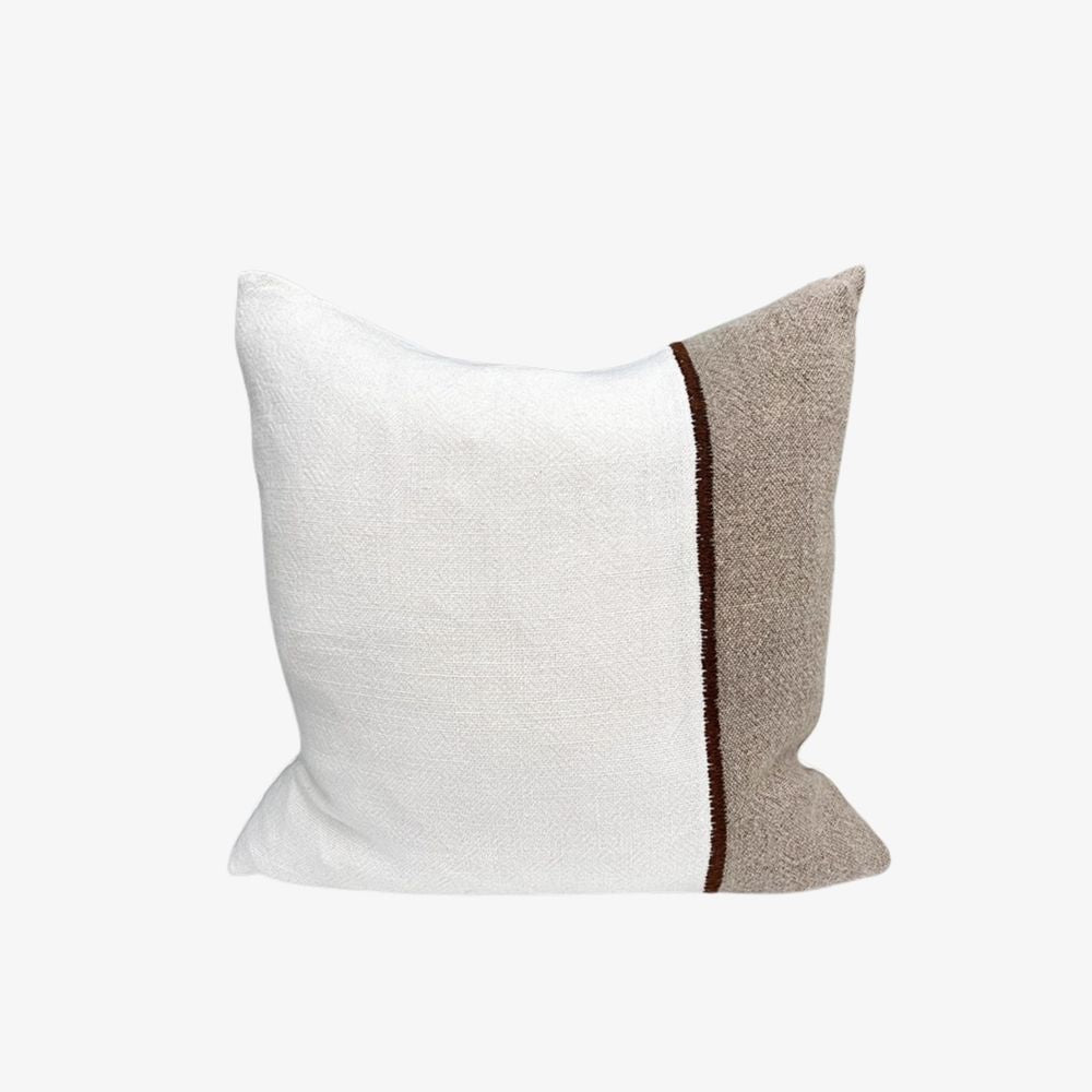 Textured fabric white and grey pillow with a brown stripe 