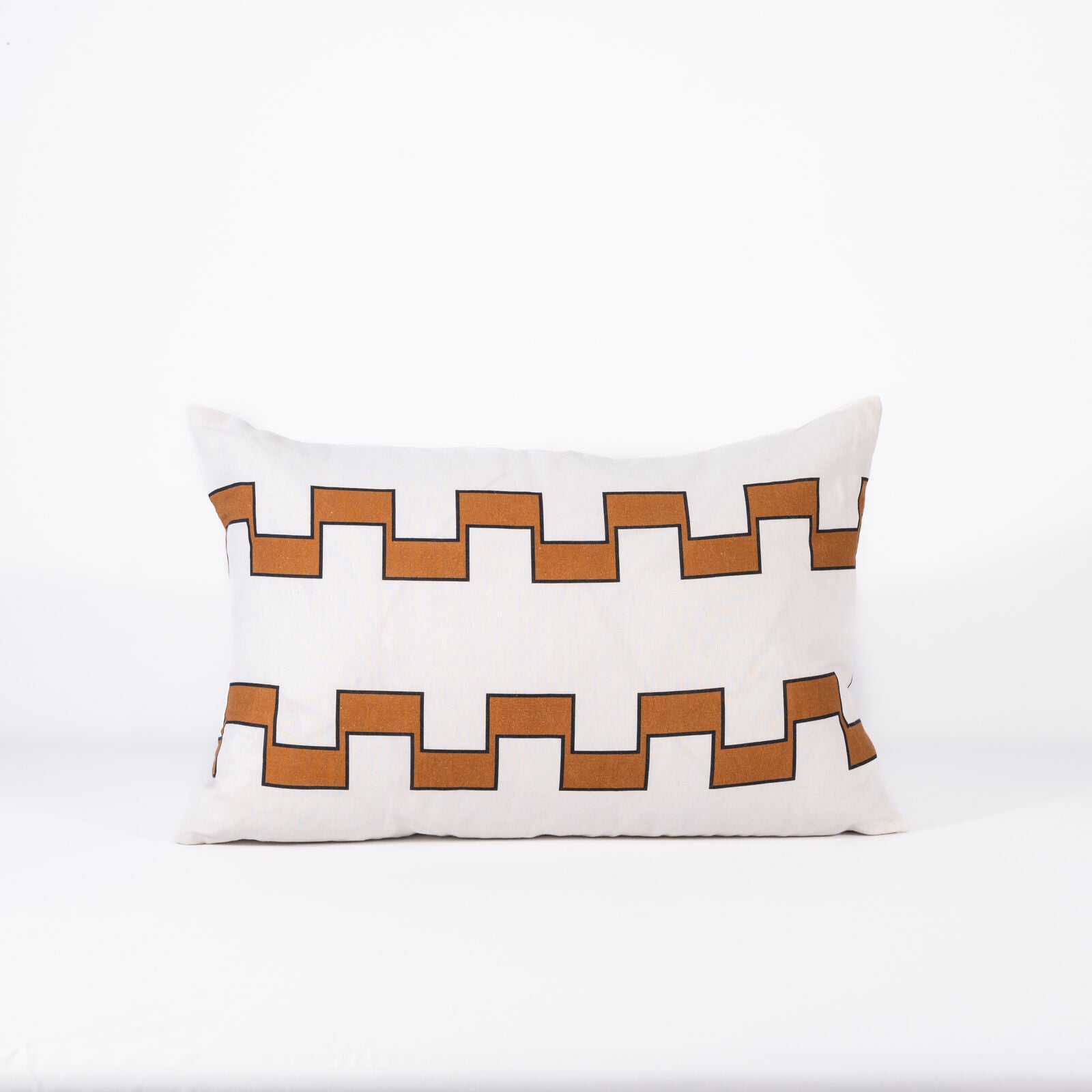 Decorative pillow with 2 lines of brown geometric pattern on a white background