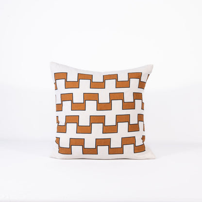 Decorative pillow with 4 lines of brown geometric pattern on a white background