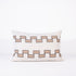 Decorative rectangular pillow with 2 lines of brown geometric pattern on a white background
