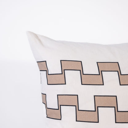 Decorative pillow with 2 lines of beige geometric pattern on a white background