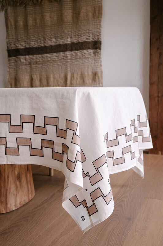 Tablecloth with geometric pattern on a wooden table