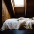 Carter Duvet on bed in Off White with Natural Stripe
