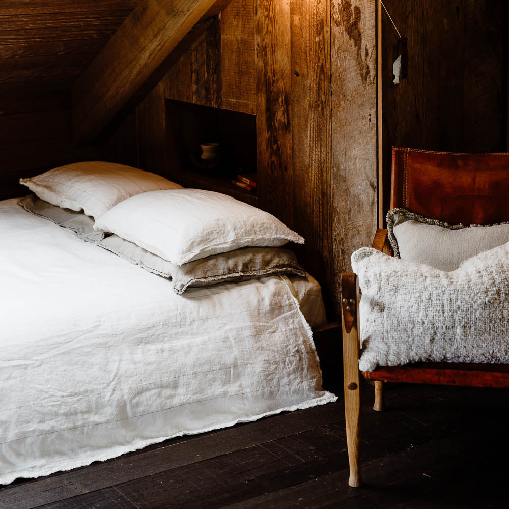 Carter Duvet on bed in Off White with Natural Stripe