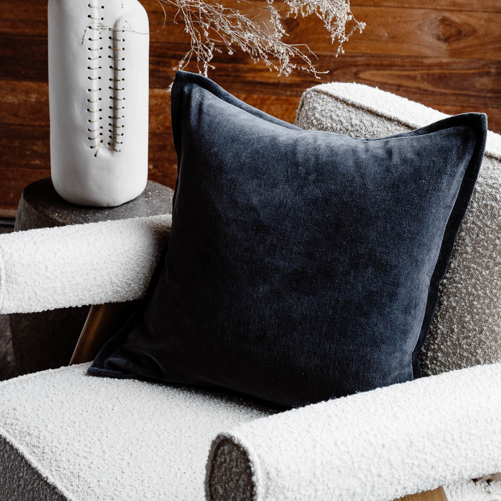 Evelyn velvet cushion in midnight on chair