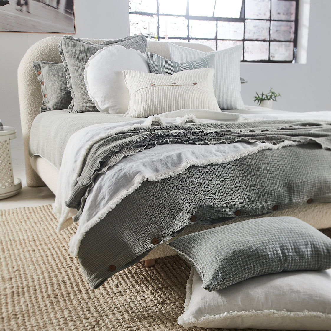bedding duvet sets styled with throws and cushions in white and pistachio greens