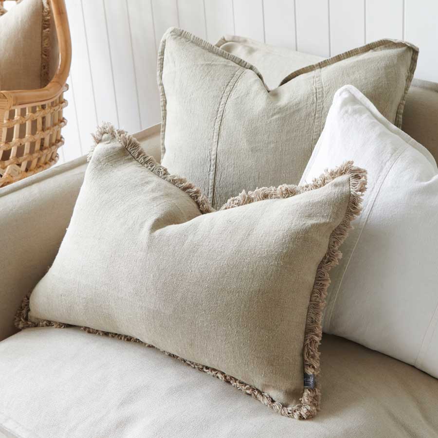 linen cushions neutral coloured with boho fringing