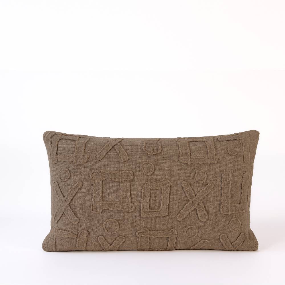 Brown textured pillow with geometric patterns on a white background
