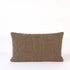 Brown textured pillow with geometric patterns on a white background