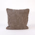 Textured pillow with geometric pattern on a white background