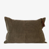 Dark green corduroy pillow with a tassel on a white background