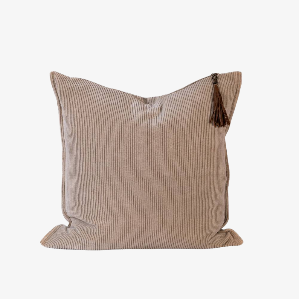 Beige pillow with a tassel 