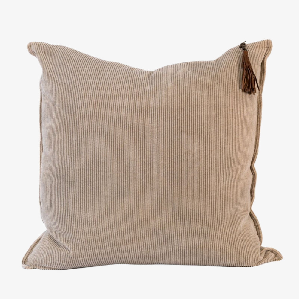 Beige pillow with a tassel 