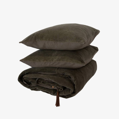Dark green stack of pillow and bedding