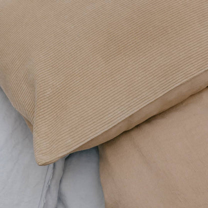 Close-up of beige textured fabric on a neutral background